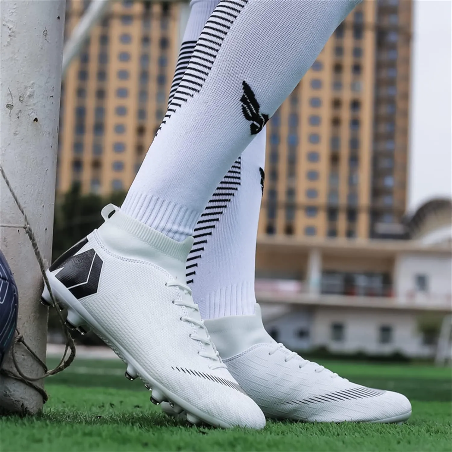 Unisex soccer sneakers are light, breathable, non-slip and shock-absorbing, and The youth high-top indoor lawn training hard bottom TF/AG.